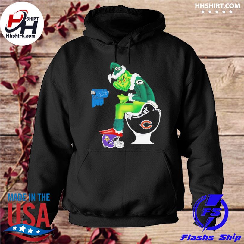 Green Bay Packers grinch sitting on Minnesota vikings toilet and step on  detroit lions helmet shirt, hoodie, sweater, long sleeve and tank top